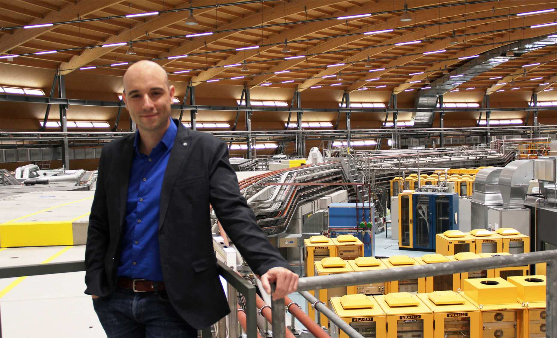 Dr. Patrick Hemberger in the hall of the synchrotron beamline at Paul Scherrer Institute (PSI)