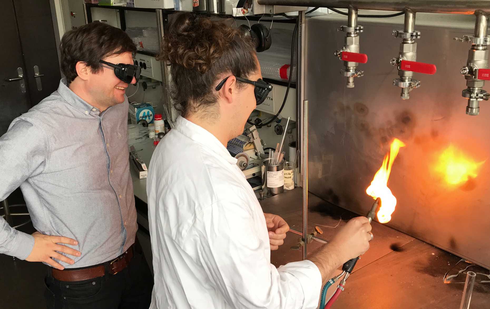 Fabian von Rohr and one of his group members producing quartz glass tubes for the crystal samples.