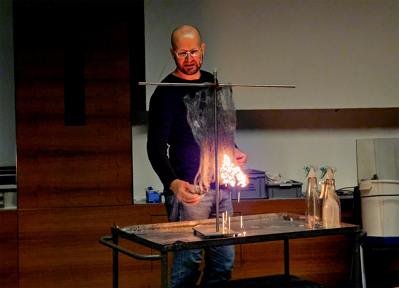 Jan Cvengros carrying out a fire experiment during his show.