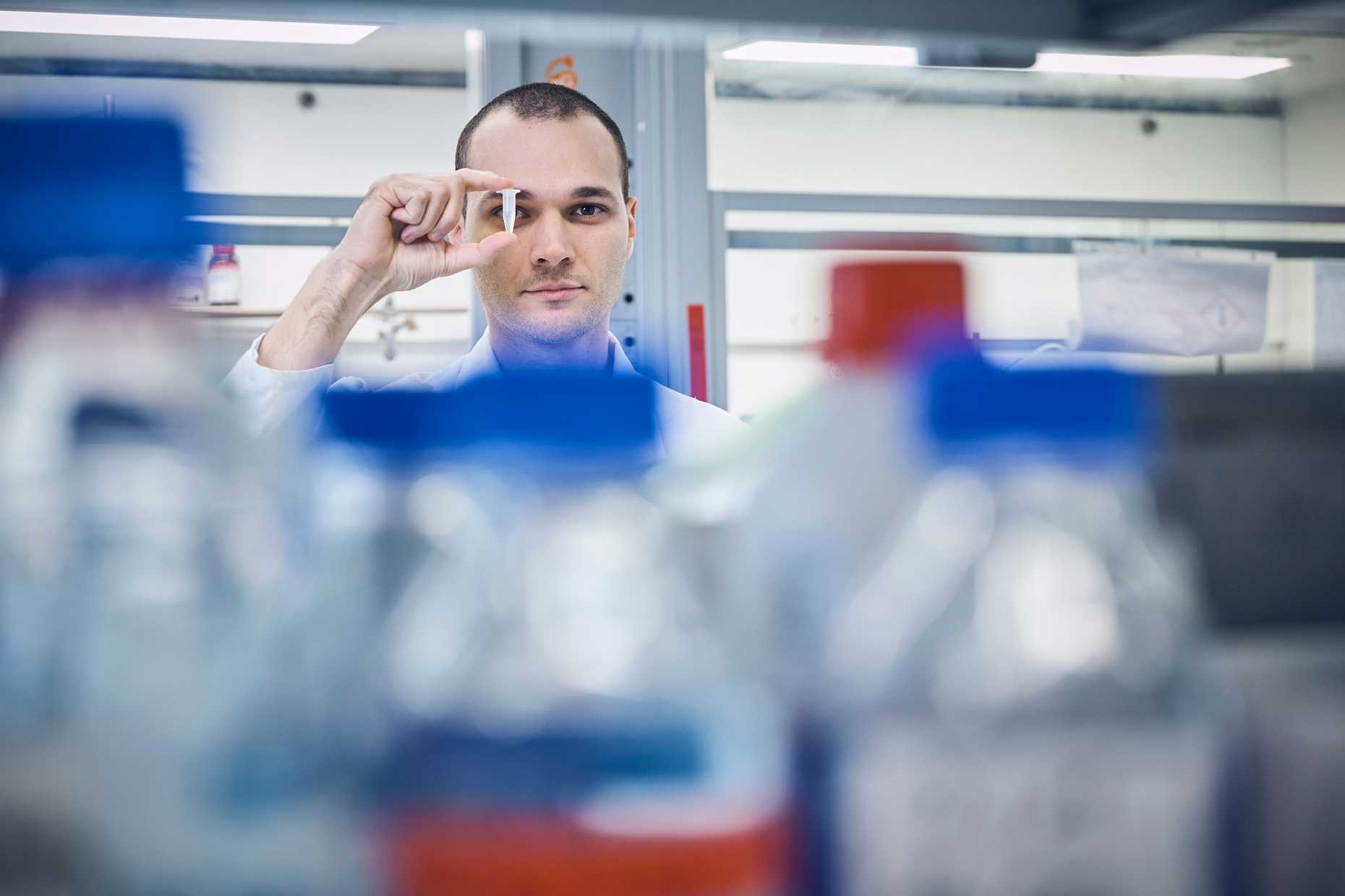 Giuseppe Antoniazzi holding an Eppendorf tube